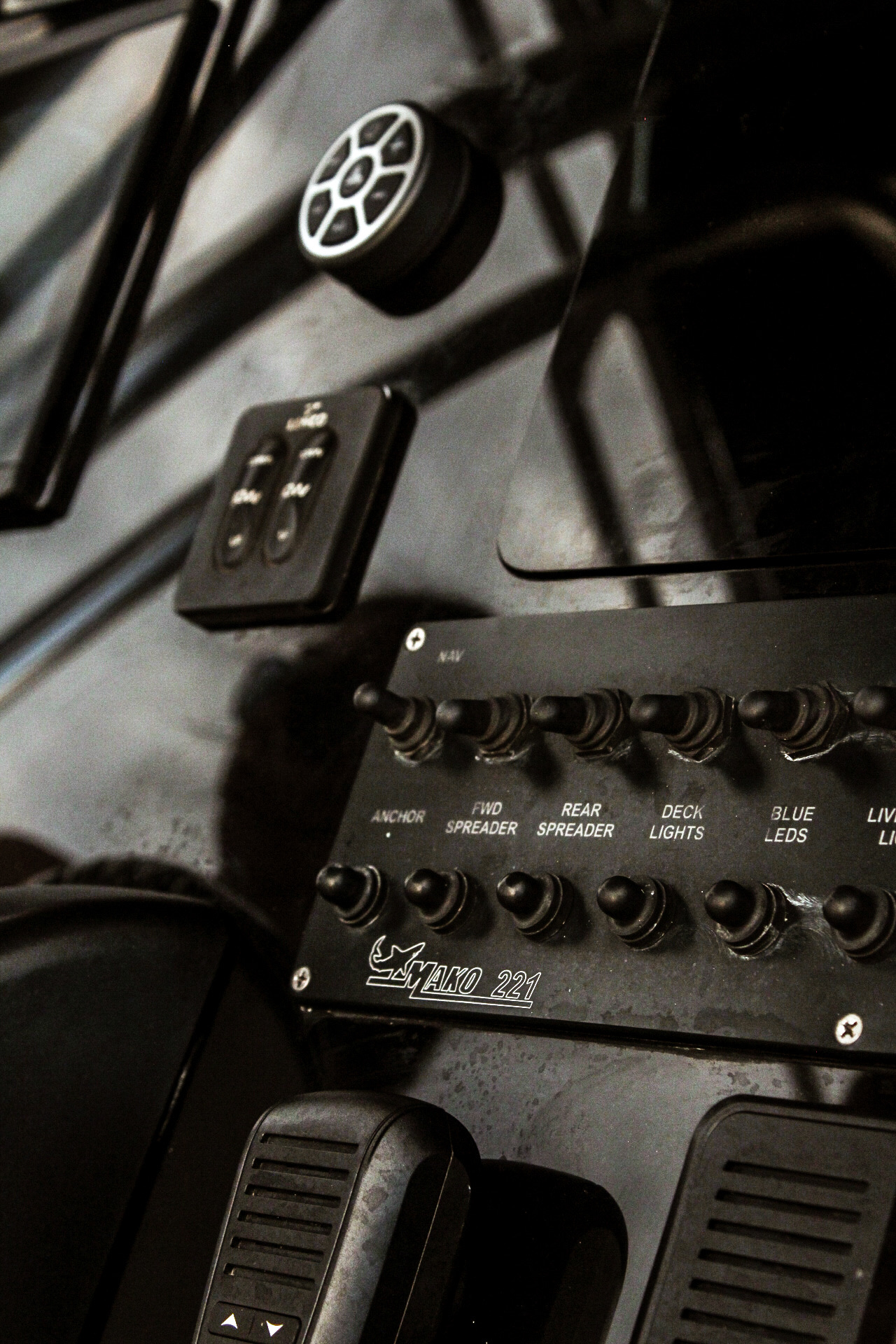 Close-up of the Mako 221 switch panel at the helm