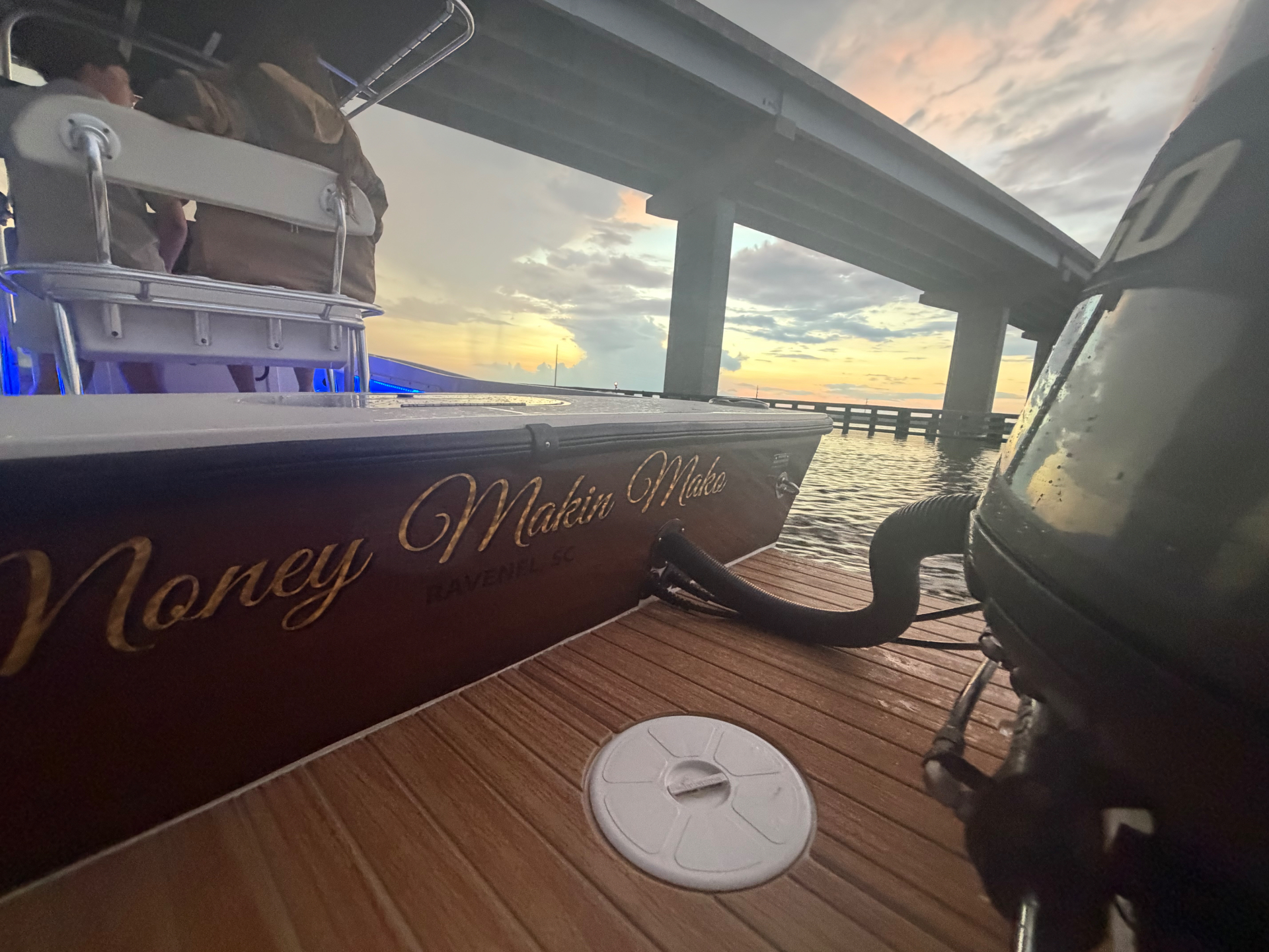 The Money Makin' Mako, a 1994 Mako 221B, at sunset beneath a Lowcountry bridge