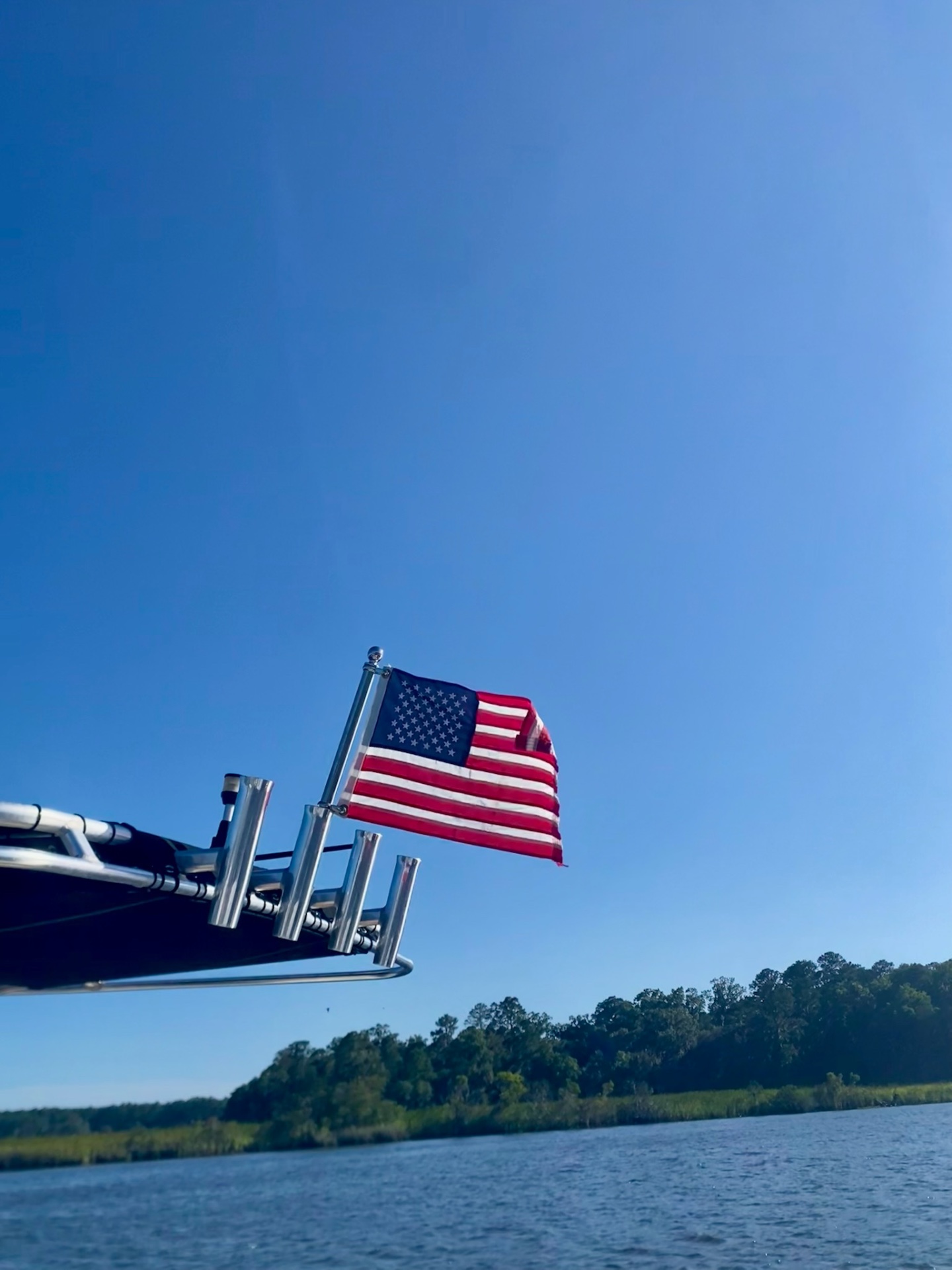 American flag flying from the T-top against a clear Lowcountry sky